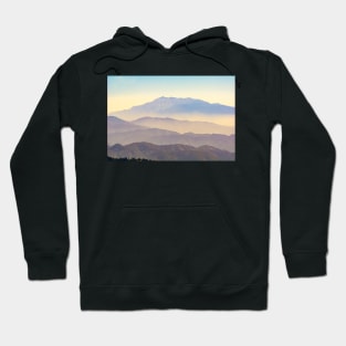 Mountain layers rising to distant peak through hazy light and different color bands. Hoodie